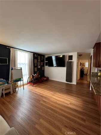 a view of a livingroom with furniture and wooden floor