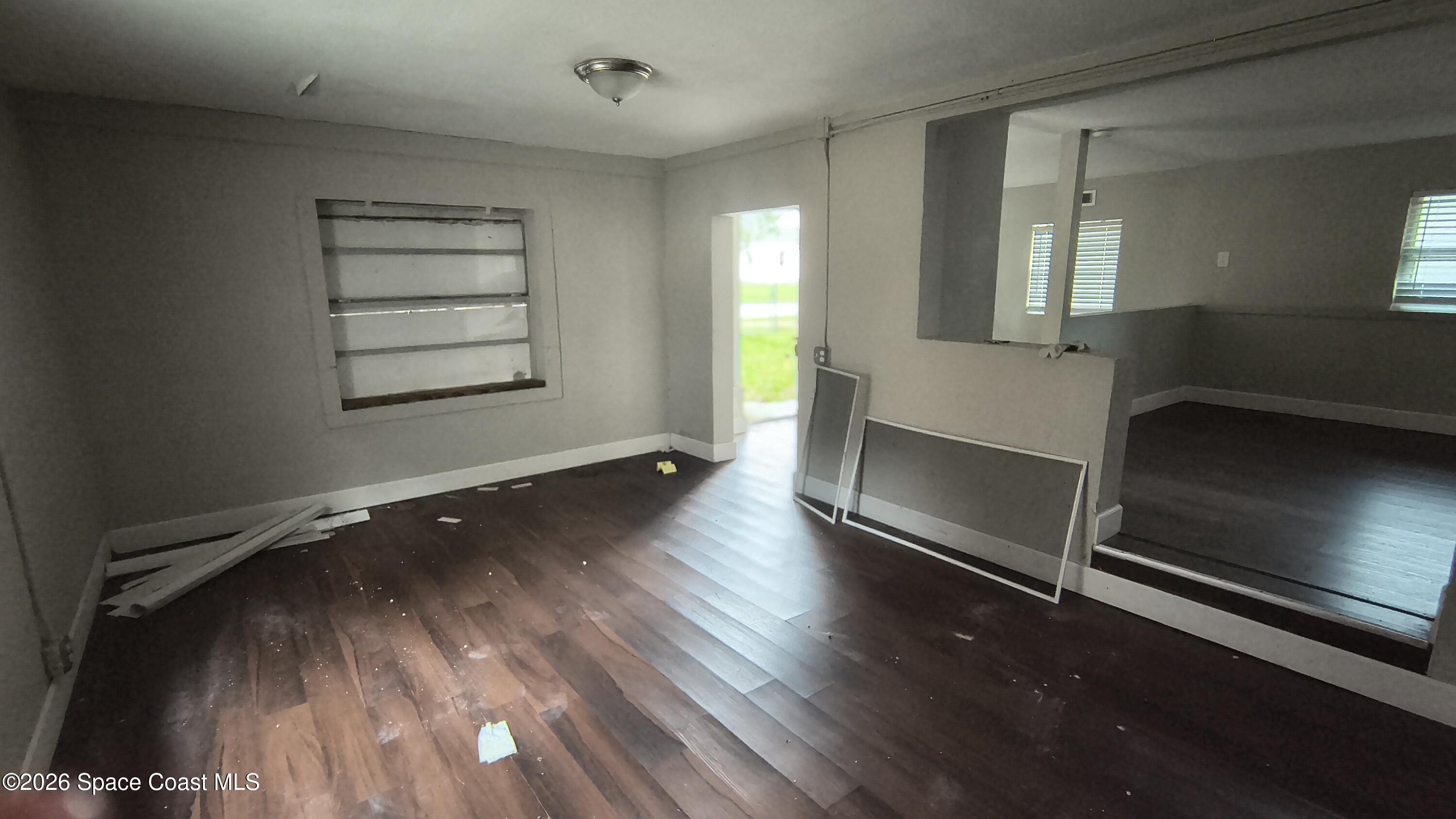 2263 Monroe Street Melbourne, FL 32905 - Photo 15 of 15 wooden floor in an empty room with a window