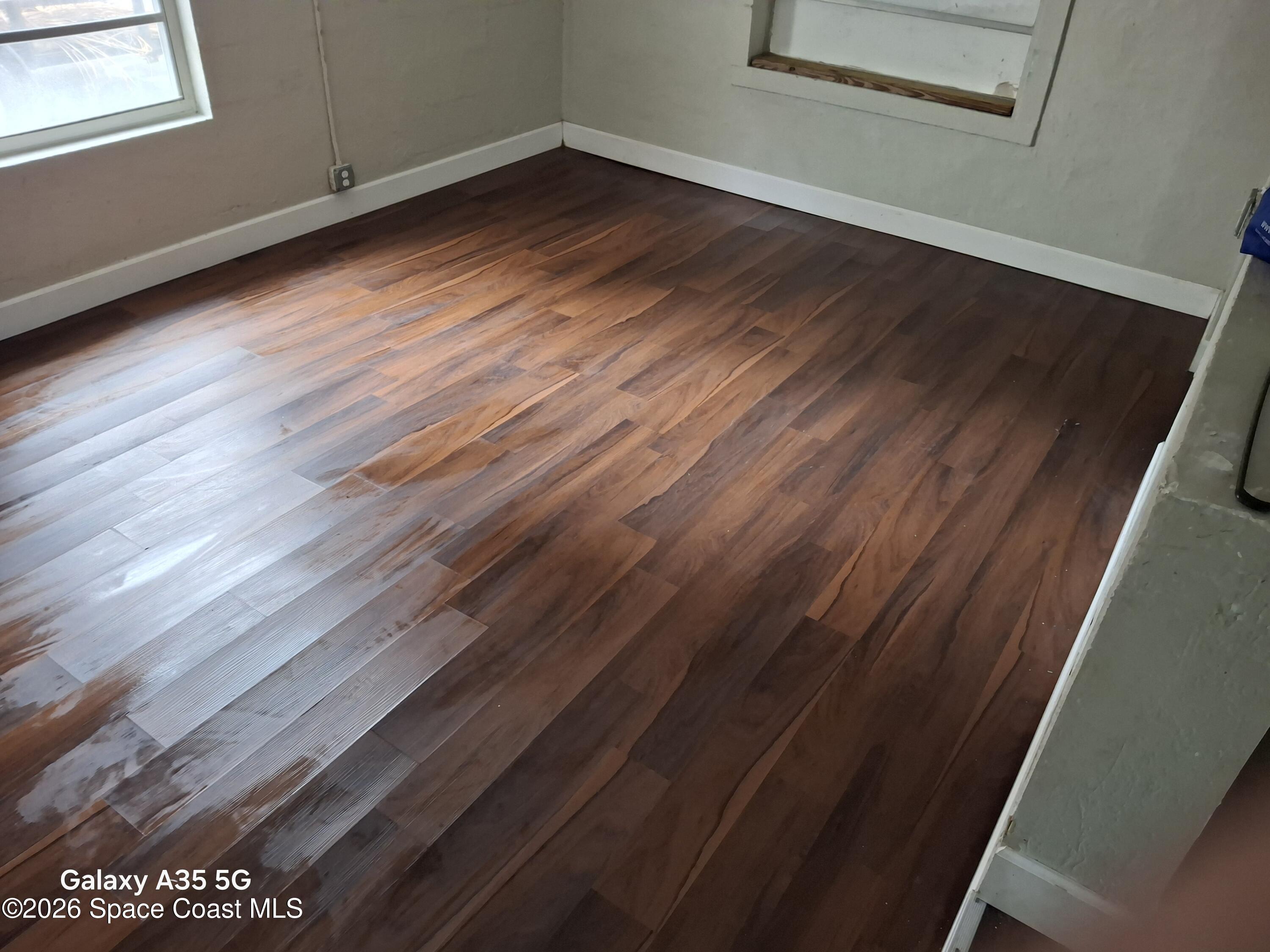 2263 Monroe Street Melbourne, FL 32905 - Photo 4 of 15 a view of a room with wooden floor and windows