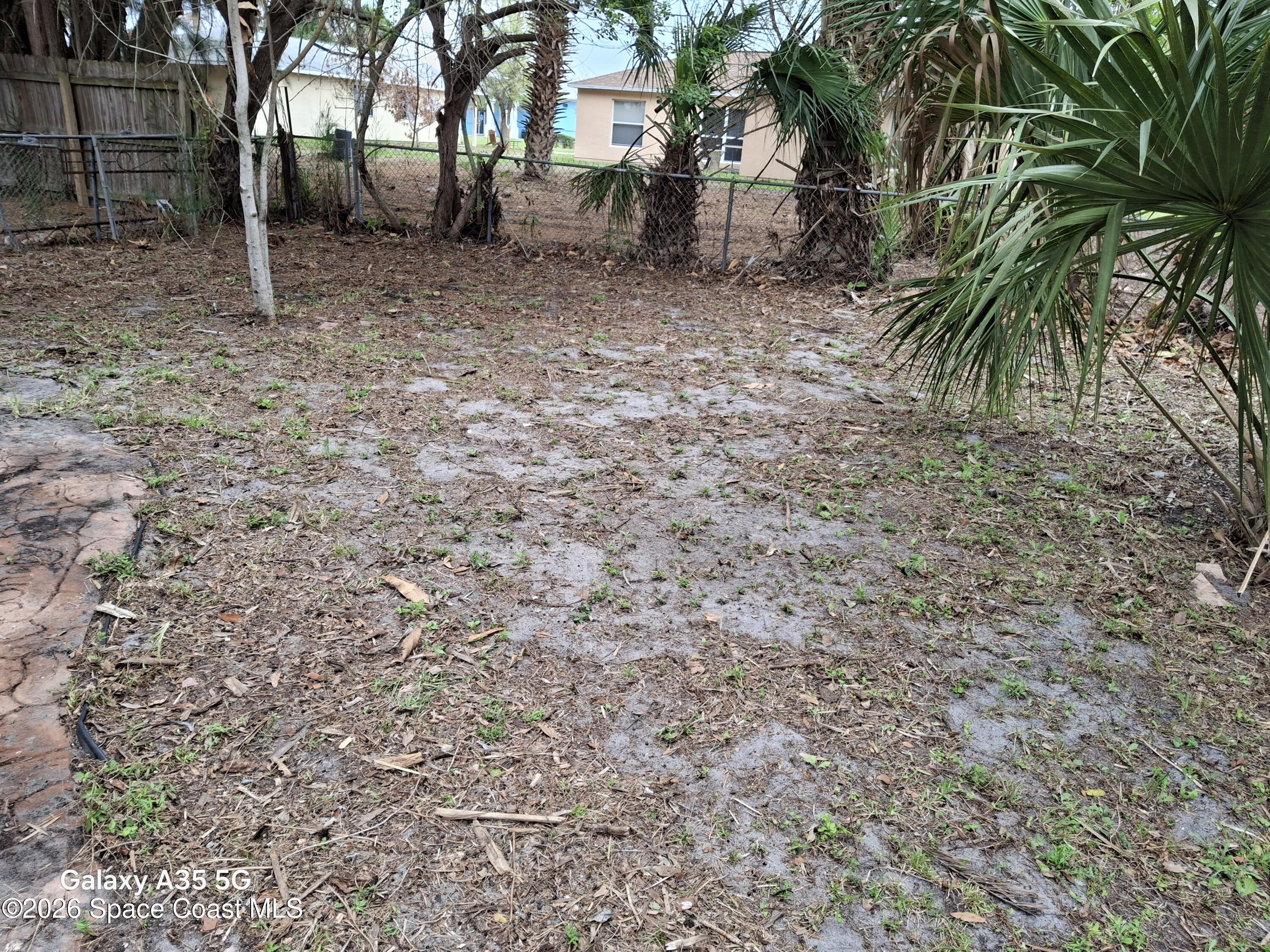 2263 Monroe Street Melbourne, FL 32905 - Photo 8 of 15 a backyard of a house with lots of green space