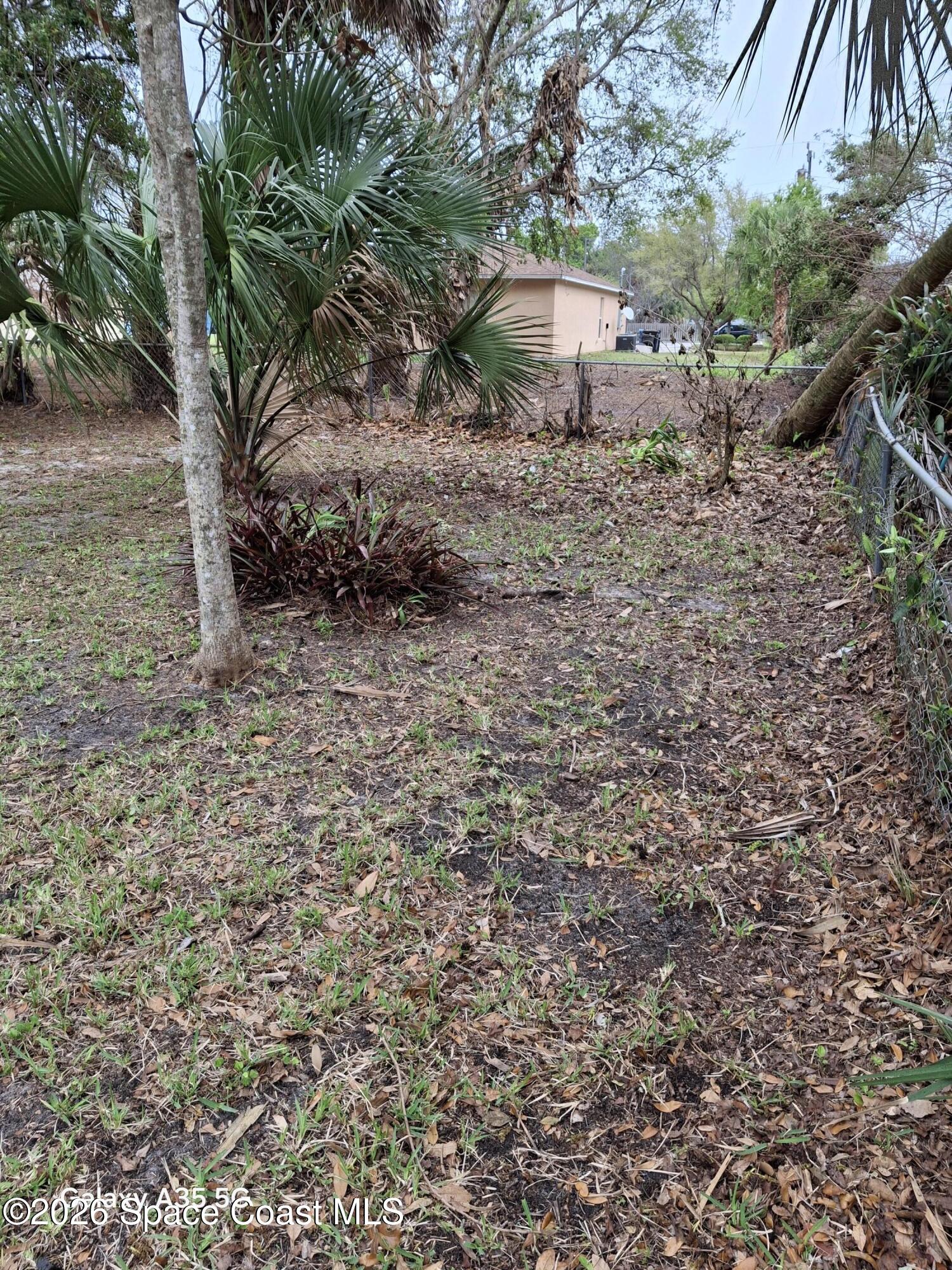 2263 Monroe Street Melbourne, FL 32905 - Photo 9 of 15 a big house with lots of trees