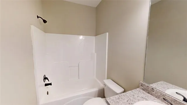 a bathroom with a bathtub and shower