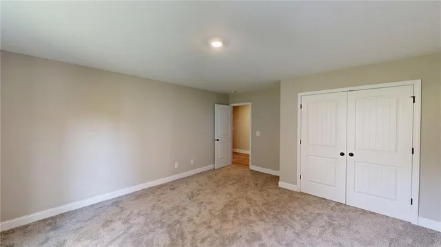 a view of an empty room and entryway