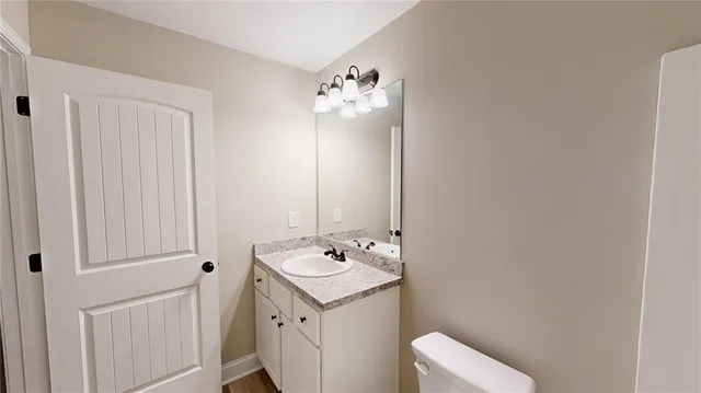 a bathroom with a sink and mirror
