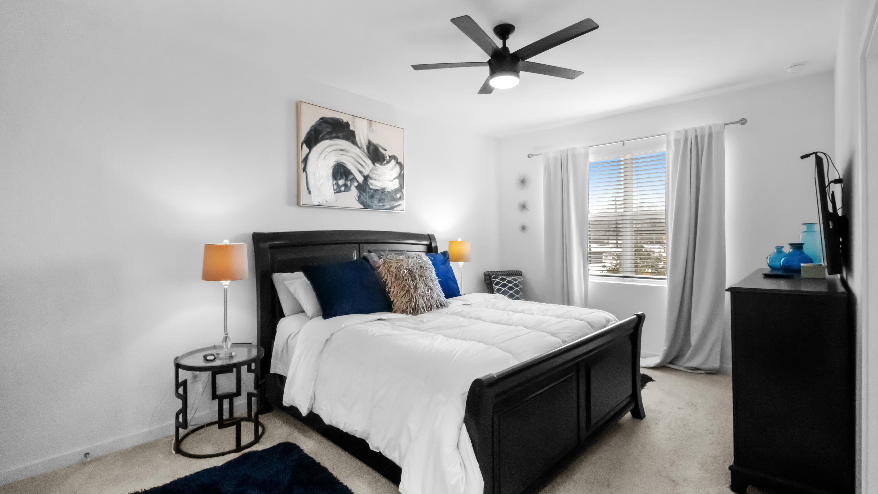 185 Bandol Street Riviera Beach, FL 33404 - Photo 13 of 28 a bedroom with a bed and wooden floor