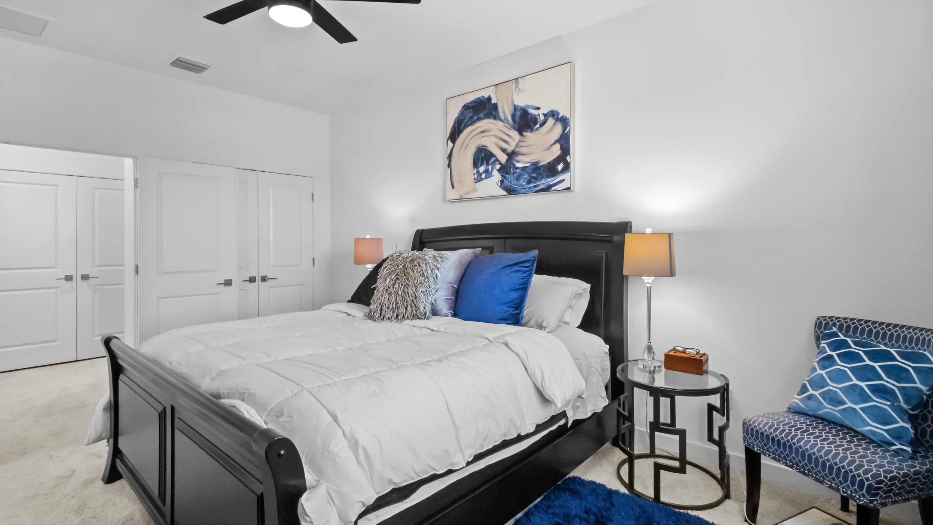 185 Bandol Street Riviera Beach, FL 33404 - Photo 14 of 28 a bedroom with a bed and a chandelier