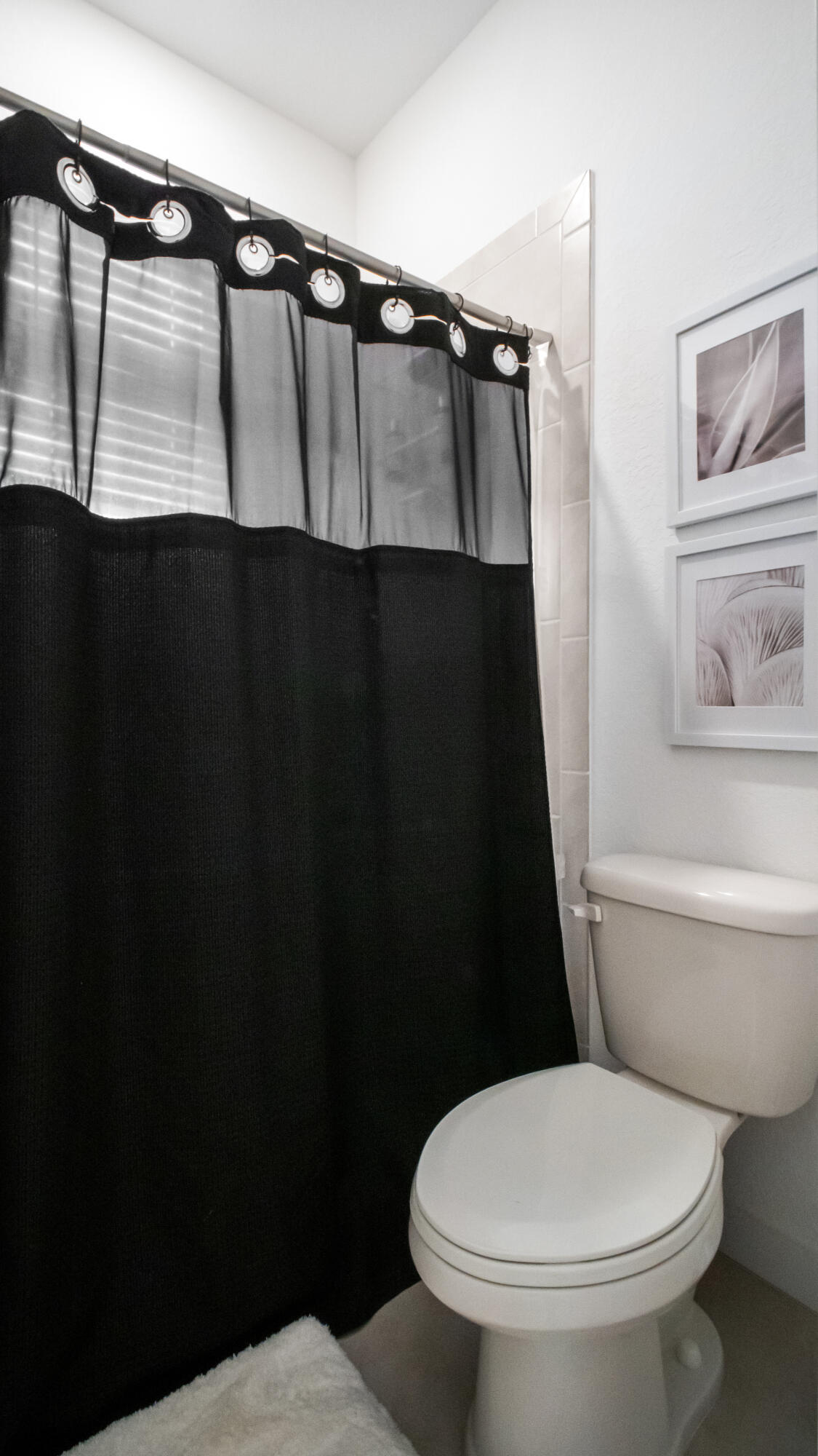 185 Bandol Street Riviera Beach, FL 33404 - Photo 17 of 28 a bathroom with a toilet and a shower