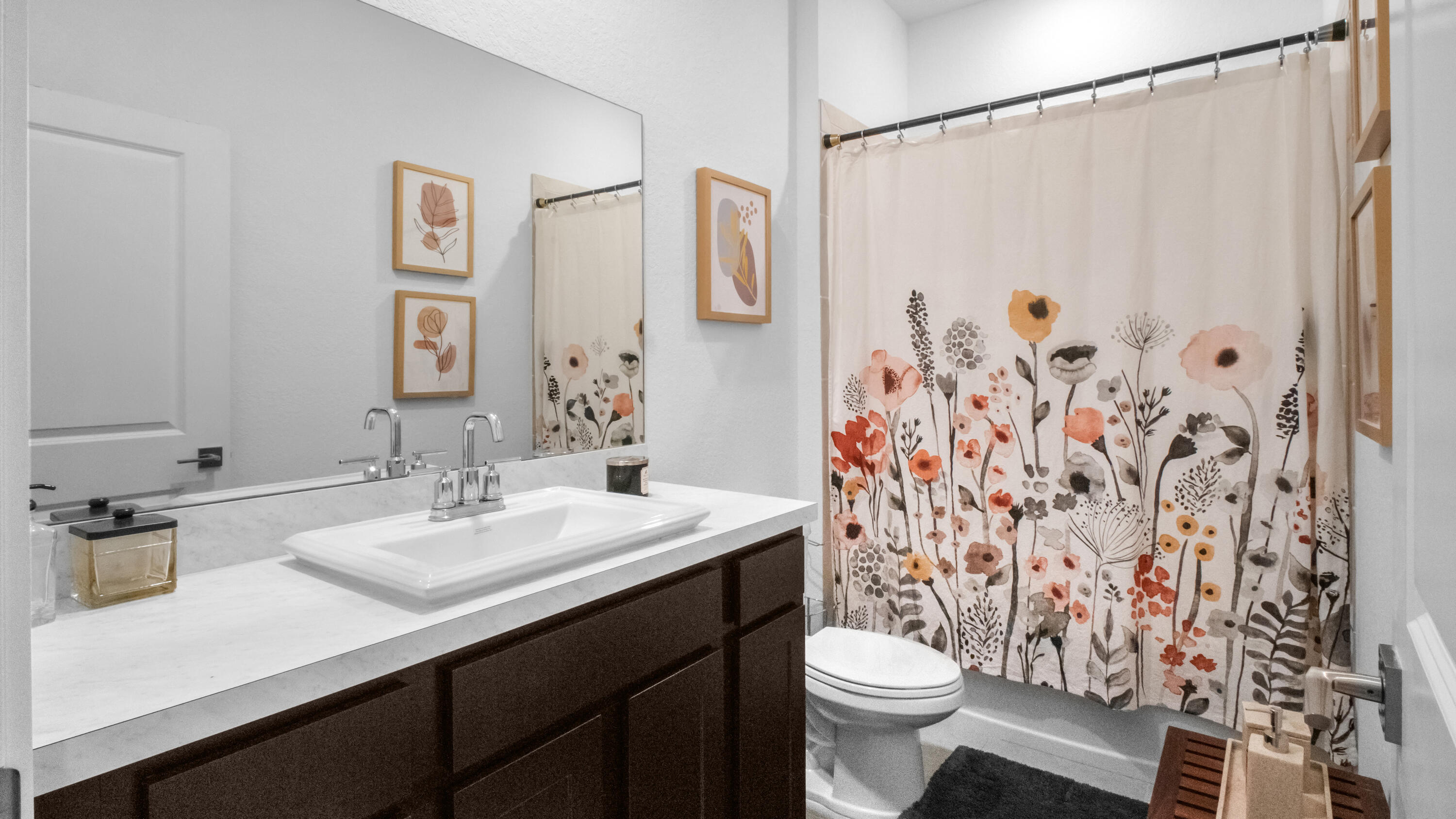 185 Bandol Street Riviera Beach, FL 33404 - Photo 20 of 28 a bathroom with a sink and a mirror
