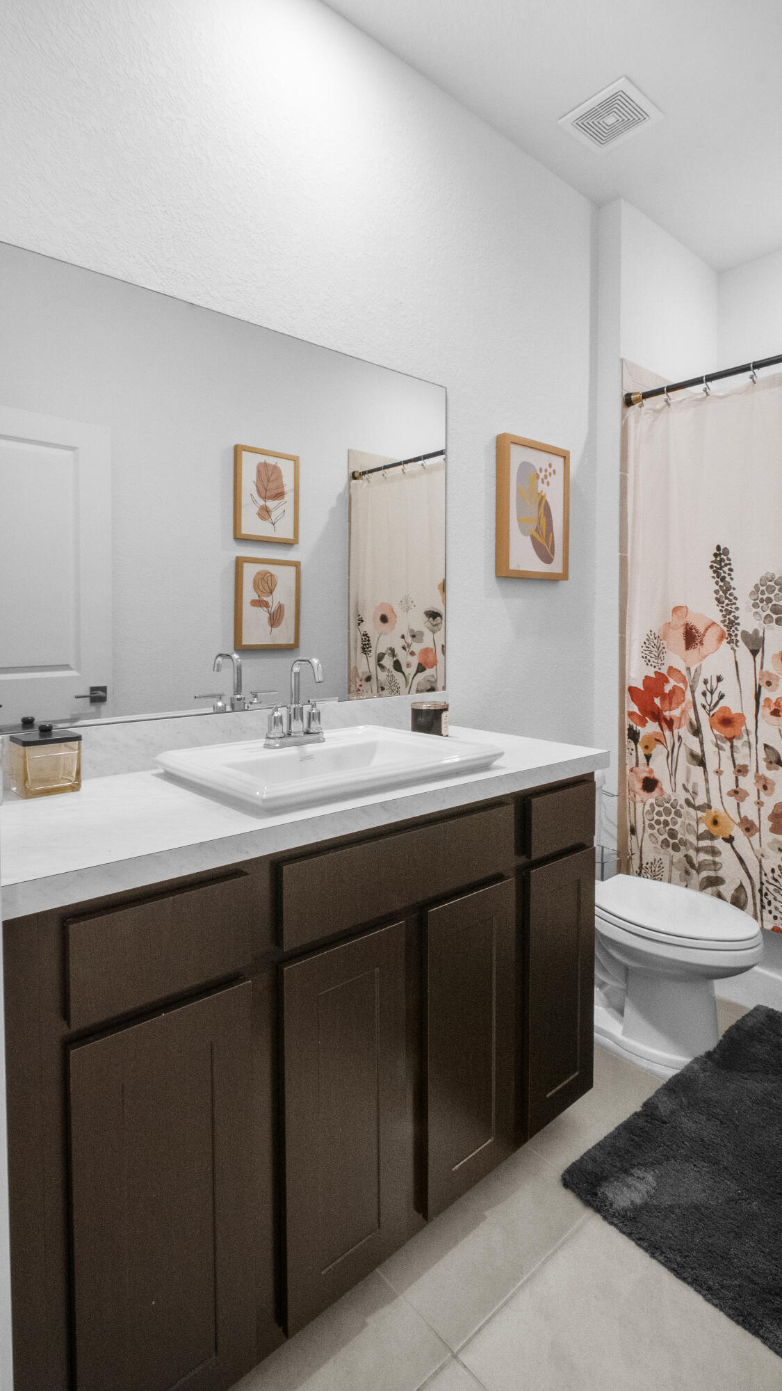 185 Bandol Street Riviera Beach, FL 33404 - Photo 21 of 28 a bathroom with a sink and a mirror