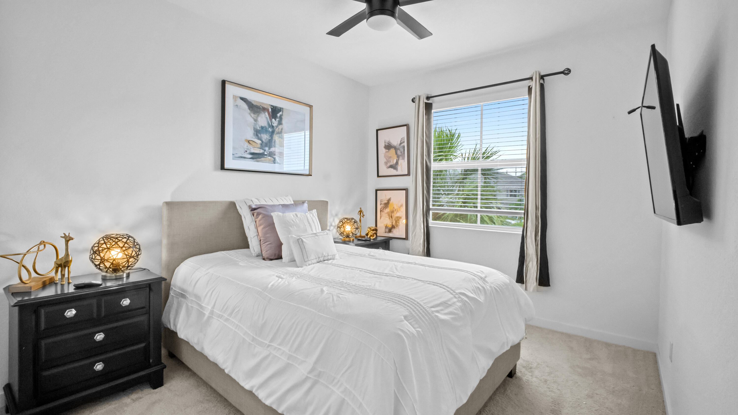 185 Bandol Street Riviera Beach, FL 33404 - Photo 25 of 28 a bedroom with a bed and a tv on the dresser
