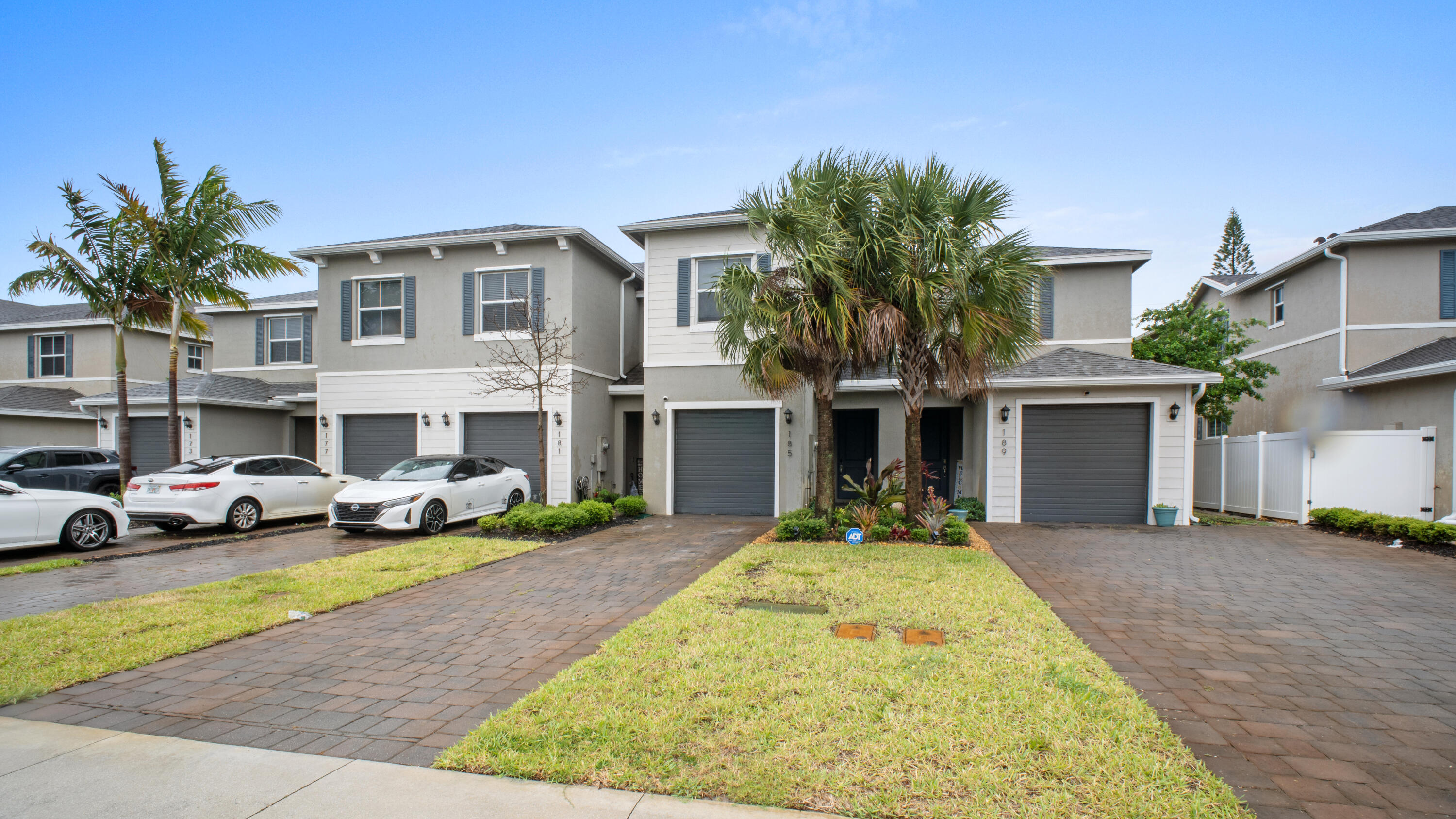 185 Bandol Street Riviera Beach, FL 33404 - Photo 27 of 28 a front view of a house with yard and parking