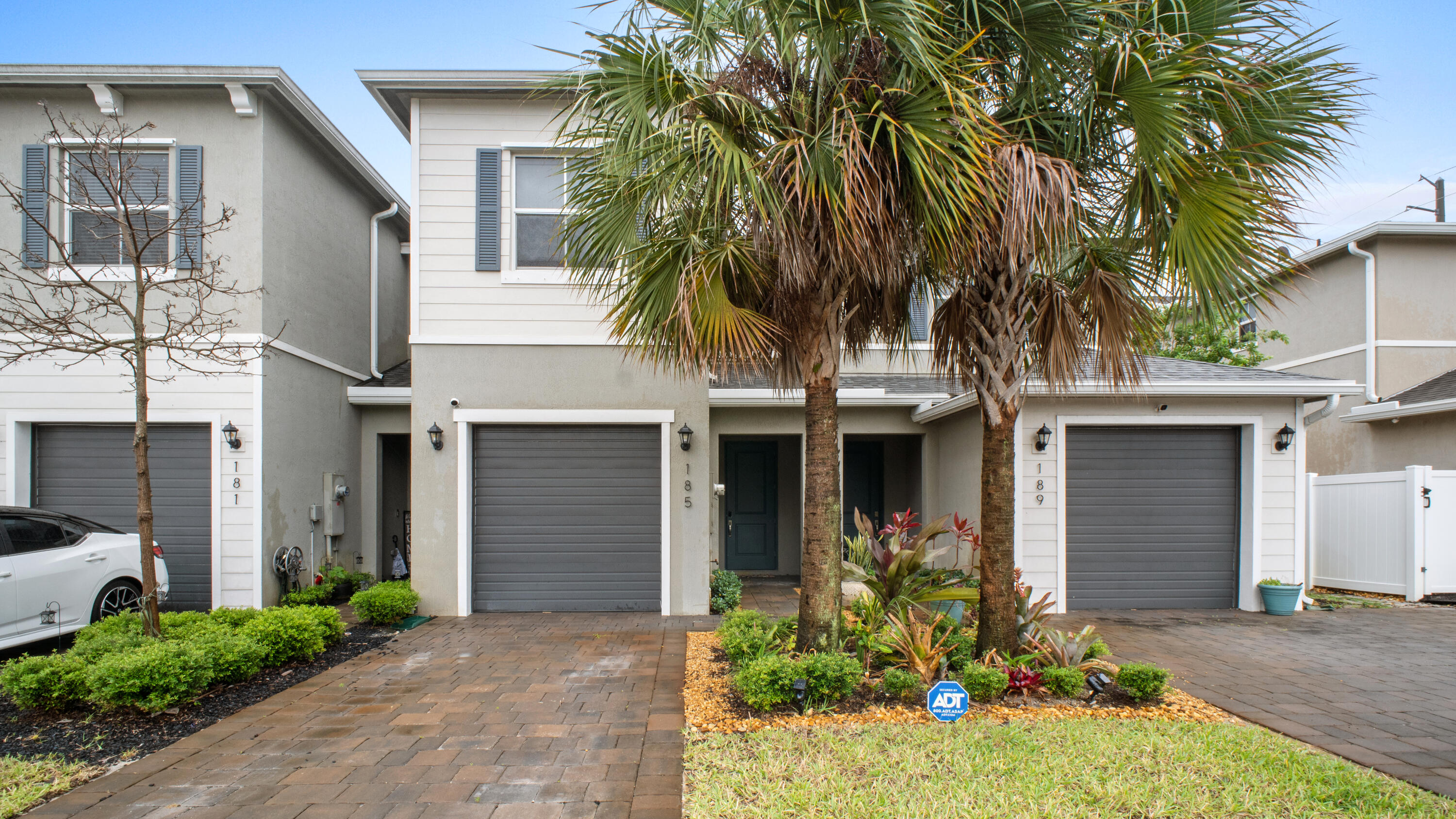 185 Bandol Street Riviera Beach, FL 33404 - Photo 28 of 28 a front view of a house with a yard