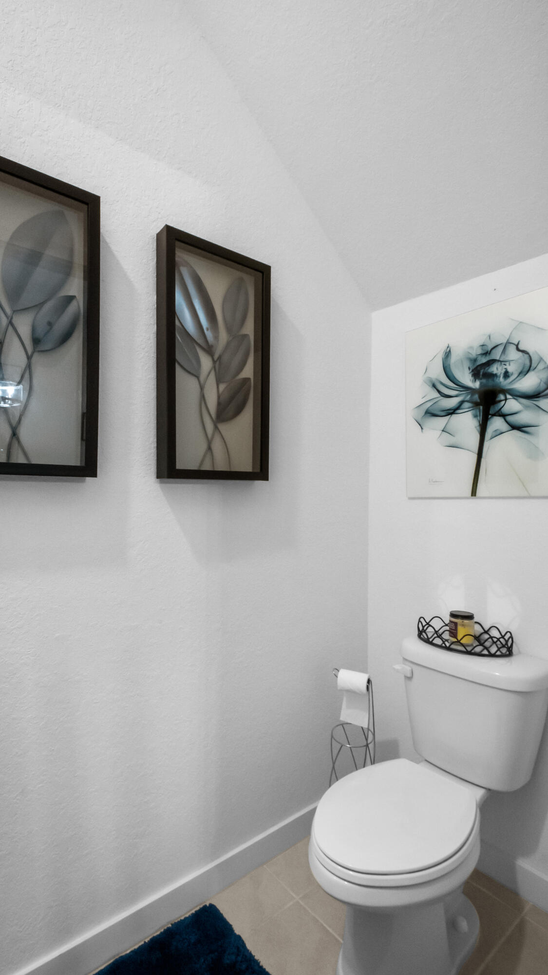 185 Bandol Street Riviera Beach, FL 33404 - Photo 10 of 28 a white toilet sitting next to a bathroom sink