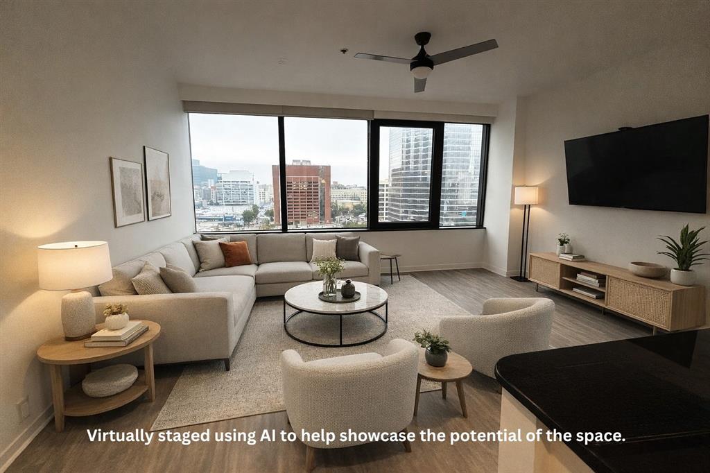 1200 Main Street, Unit 902 Dallas, TX 75202 - Photo 13 of 21 a living room with furniture and a flat screen tv