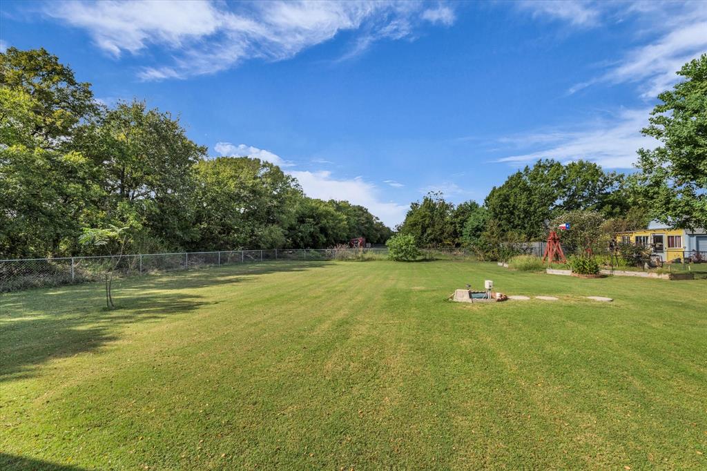 107 Fort Graham Circle Waco, TX 76705 - Photo 34 of 39 View of yard with view of scattered trees