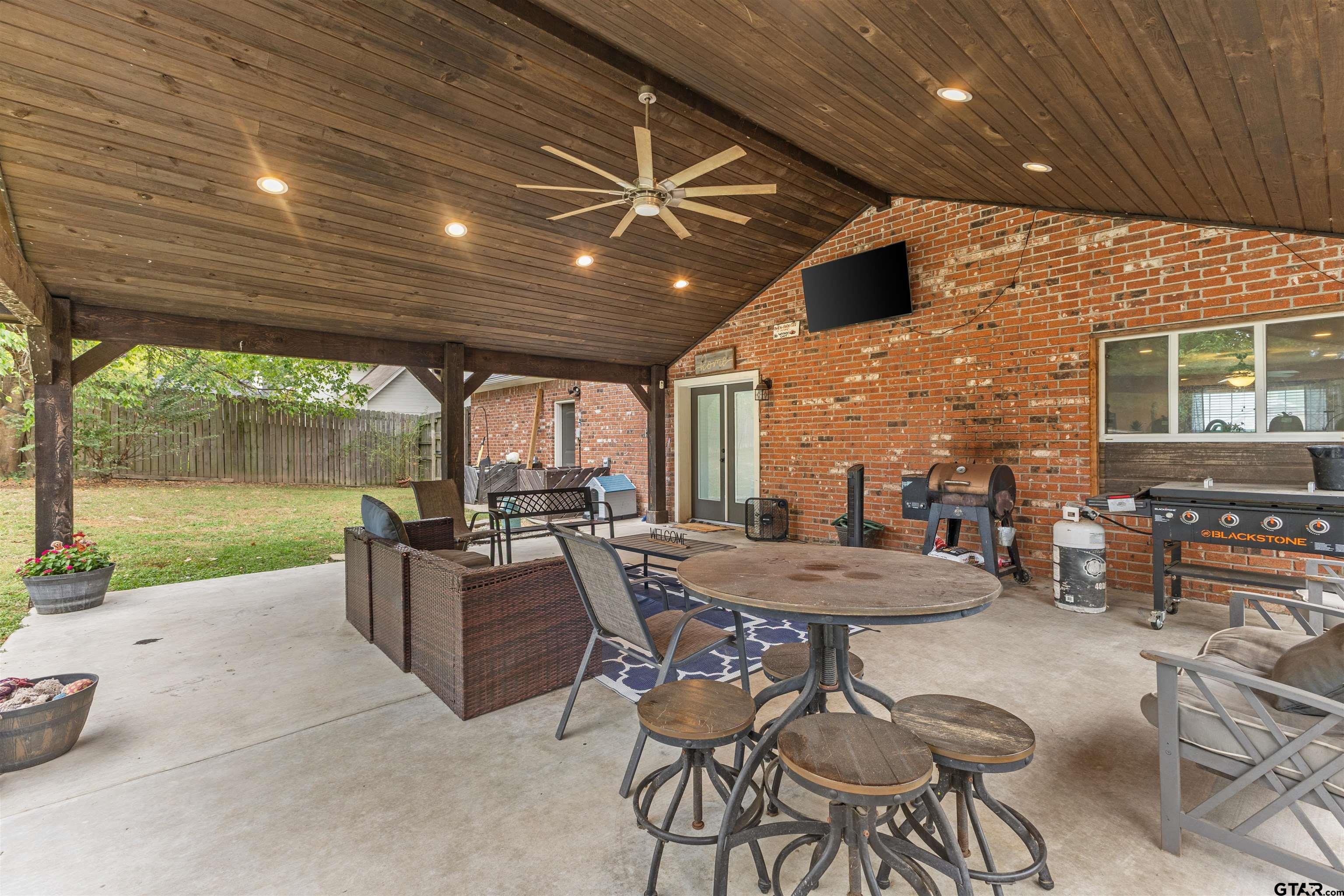 106 Pecan Ridge Mount Vernon, TX 75457 - Photo 29 of 31 a view of a patio with a table and chairs
