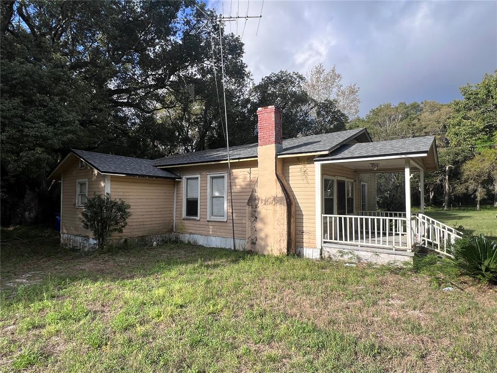 177 East 3rd Avenue Pierson, FL 32180 - Photo 3 of 16 a front view of a house with garden