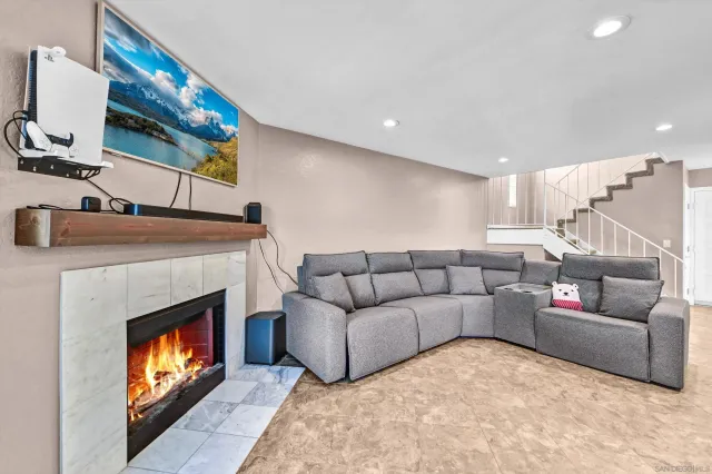 a living room with furniture and a fireplace