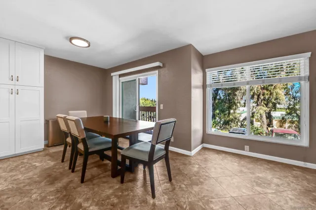 a view of a dining room with furniture window and outside view