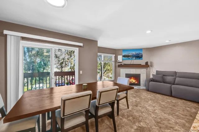 a dining room with furniture and a fireplace