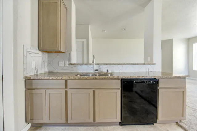 a view of staircase with lots of frames on wall and stairs