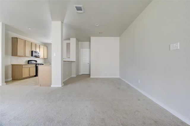 a view of a backyard with a garden and entryway