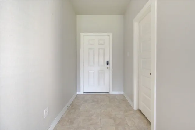 a view of a livingroom with furniture and a ceiling fan