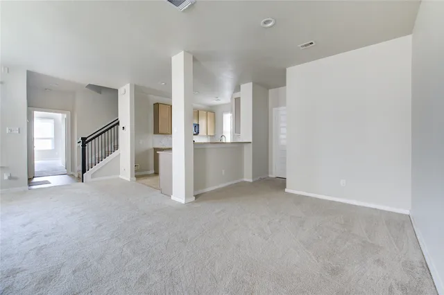 an empty room with closet area