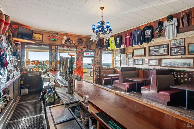 a room with furniture projector and a chandelier