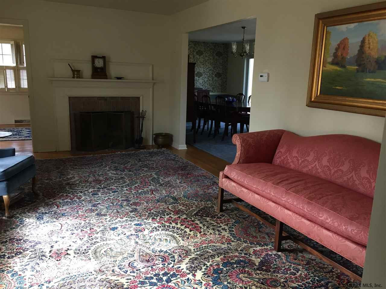 66 Cambridge Road Bethlehem, NY 12077 - Photo 12 of 23 with nice fireplace and mantle