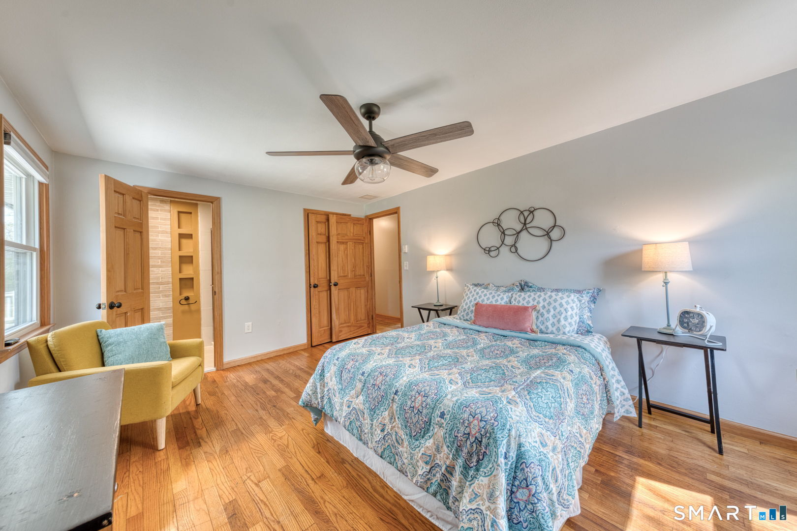 341 Main Street Middlefield, CT 06481 - Photo 13 of 30 a bedroom with a large bed and a chandelier