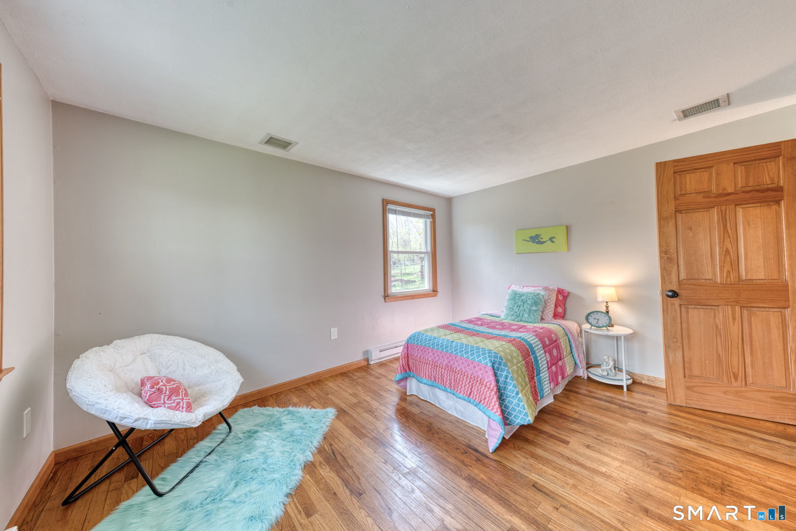 341 Main Street Middlefield, CT 06481 - Photo 15 of 30 a bedroom with a bed and wooden floor