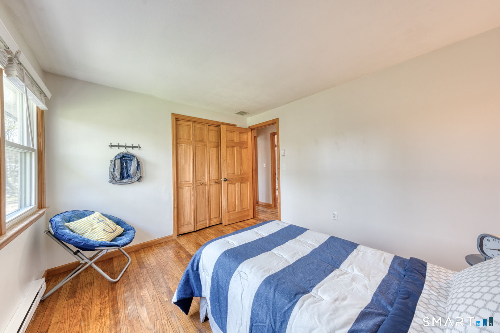 341 Main Street Middlefield, CT 06481 - Photo 18 of 30 a bedroom with a bed and a table in it