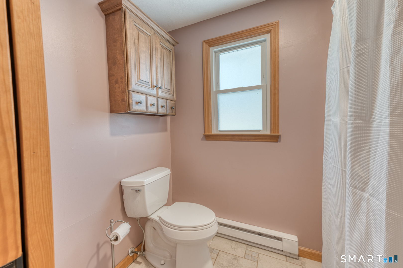 341 Main Street Middlefield, CT 06481 - Photo 20 of 30 a toilet sitting in a bathroom next to a window