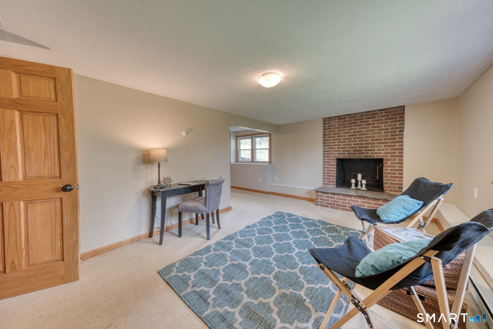 341 Main Street Middlefield, CT 06481 - Photo 21 of 30 a living room with furniture and a fireplace