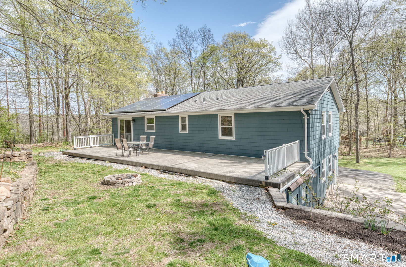 341 Main Street Middlefield, CT 06481 - Photo 28 of 30 a view of a house with a yard patio and fire pit