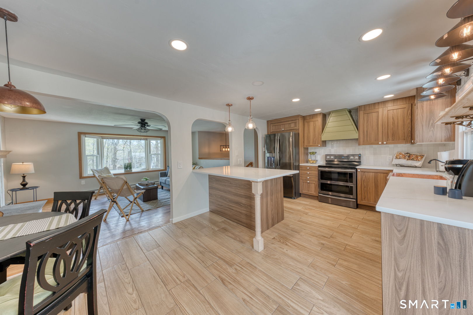 341 Main Street Middlefield, CT 06481 - Photo 7 of 30 a large kitchen with a table and chairs in it