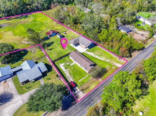 a front view of house with yard and swimming pool