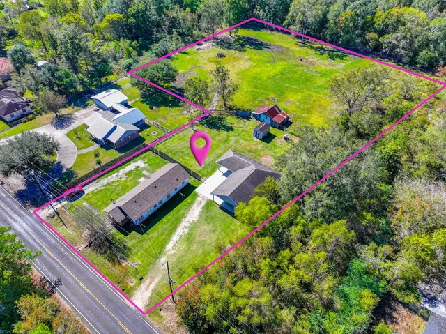 a view of house with yard
