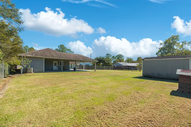 a front view of house with yard and entertaining space