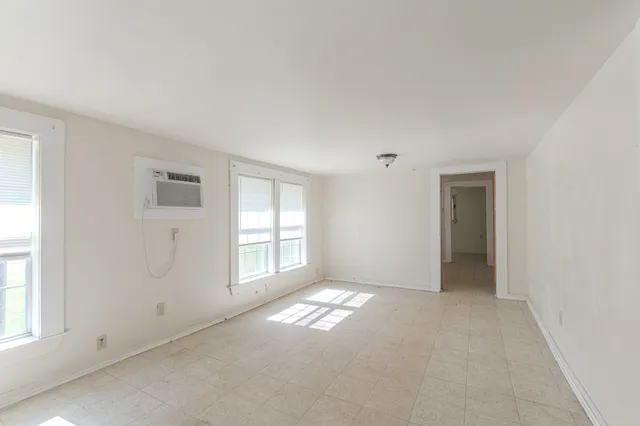 a view of an empty room with a window