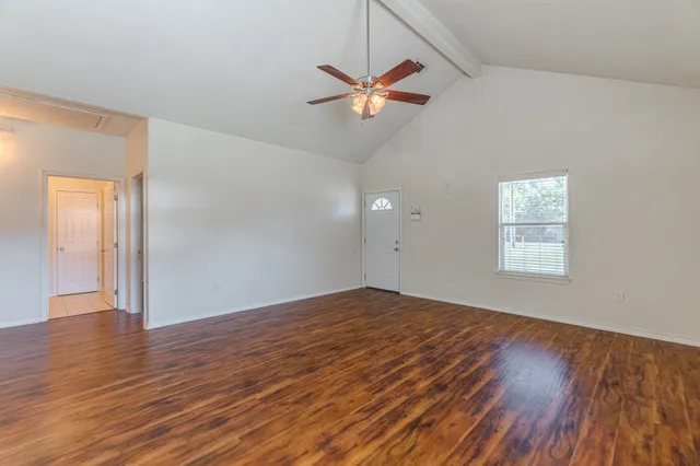 a kitchen with a stove a sink and a refrigerator