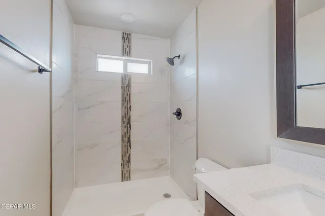 a bathroom with a bathtub and shower