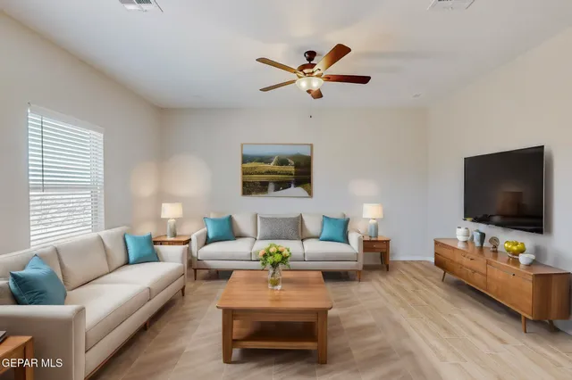 a bedroom with a bed and a painting on the wall