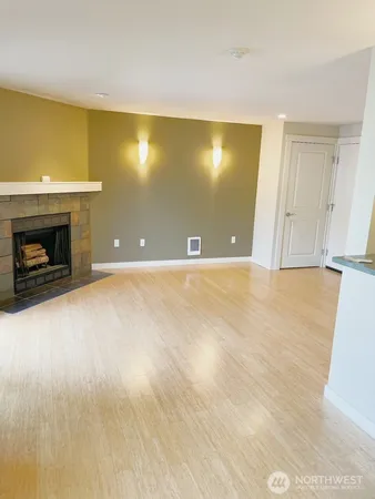 a view of an empty room with a fireplace