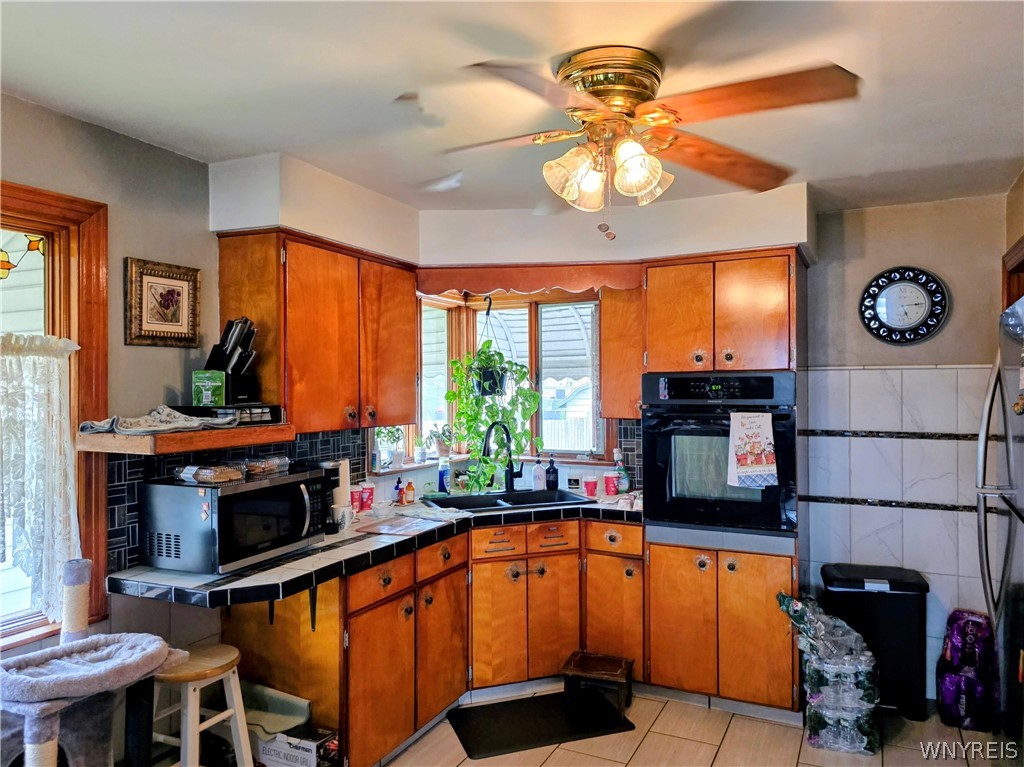 1687 Abbott Road Lackawanna, NY 14218 - Photo 3 of 27 Lower kitchen, has a breakfast Bar as well as a dining area now used as an office