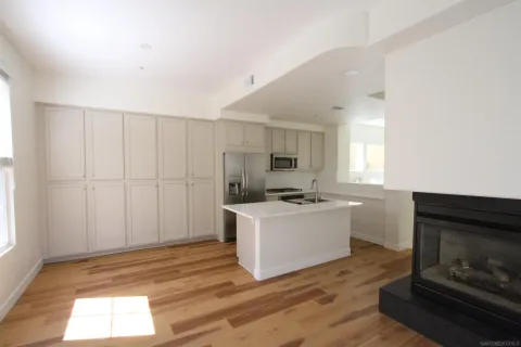 a room with a window and wooden floor