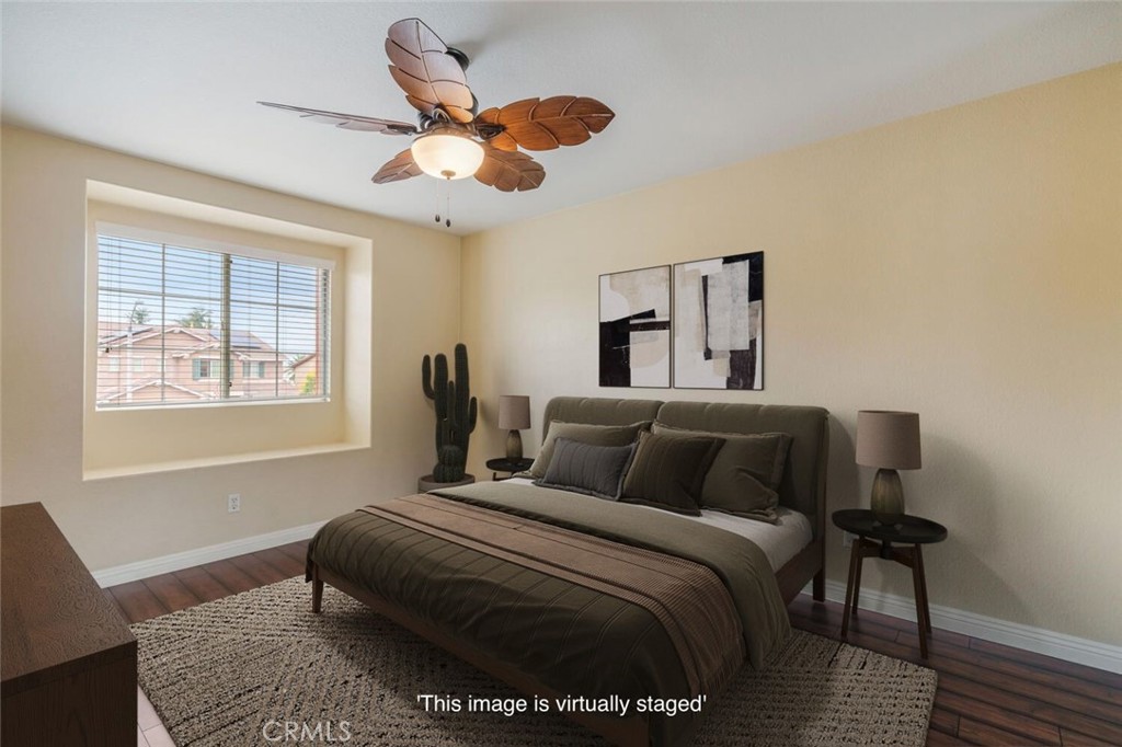 17262 Hawkwood Drive Riverside, CA 92503 - Photo 14 of 33 a bedroom with a bed and wooden floor