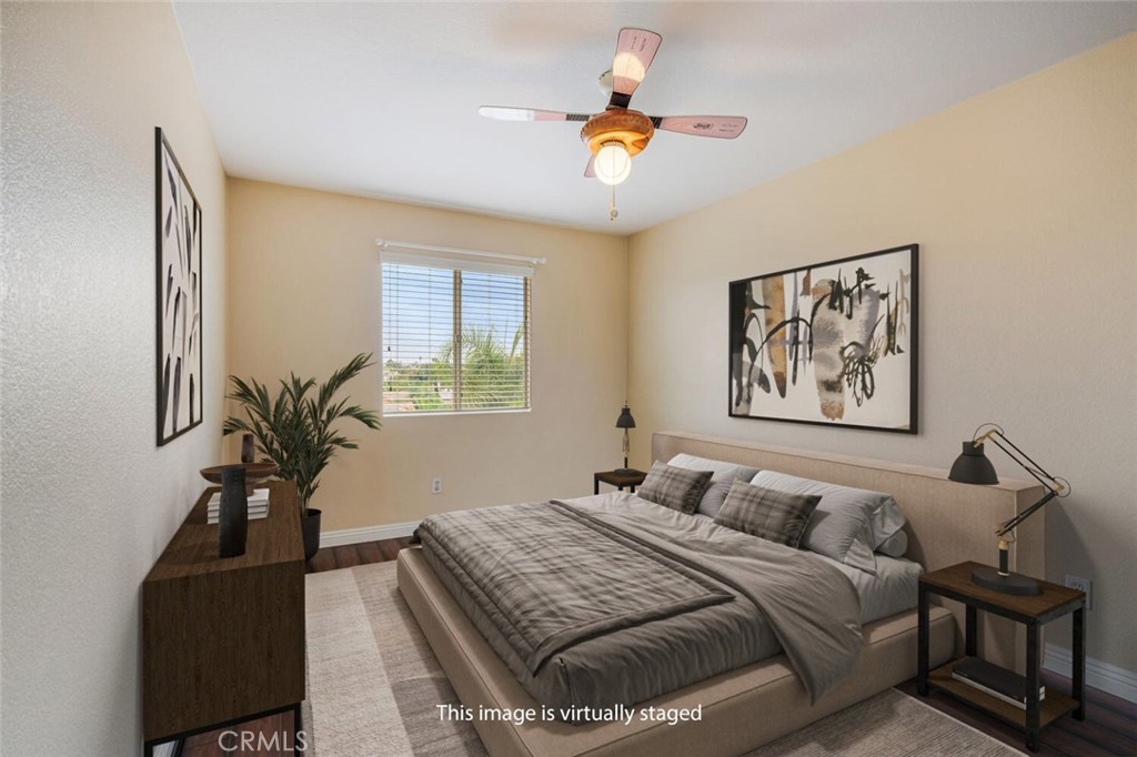 17262 Hawkwood Drive Riverside, CA 92503 - Photo 15 of 33 a bedroom with a bed and wooden floor