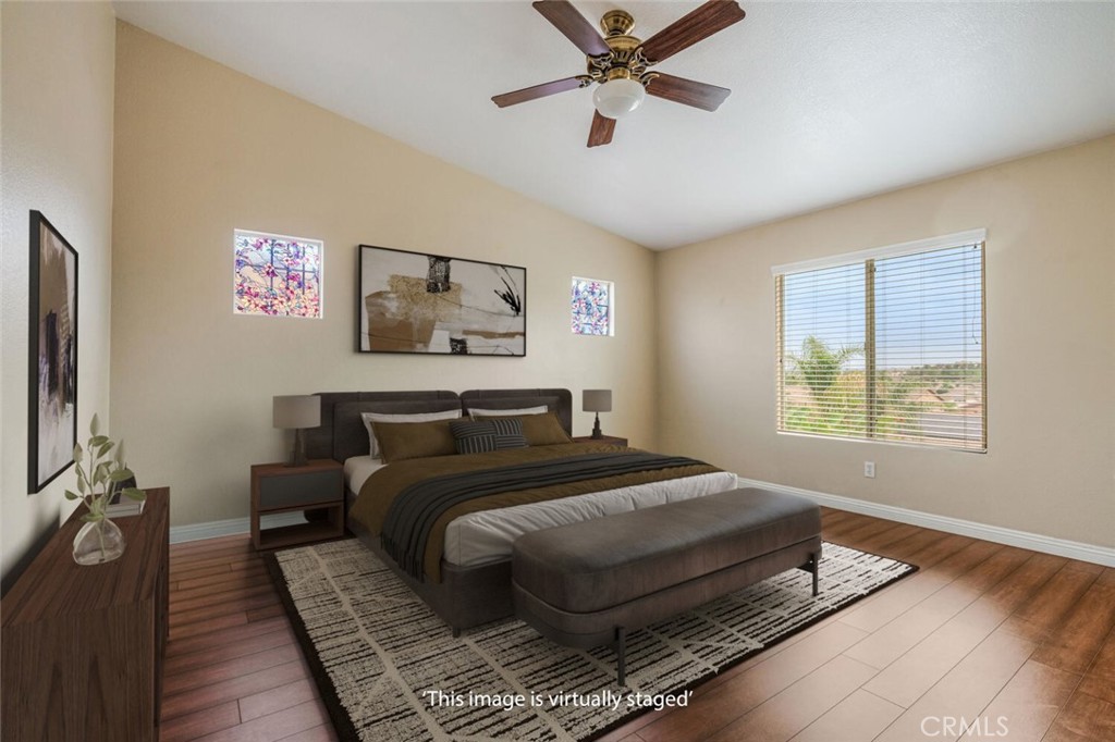 17262 Hawkwood Drive Riverside, CA 92503 - Photo 16 of 33 a bed sitting in a bedroom next to a window